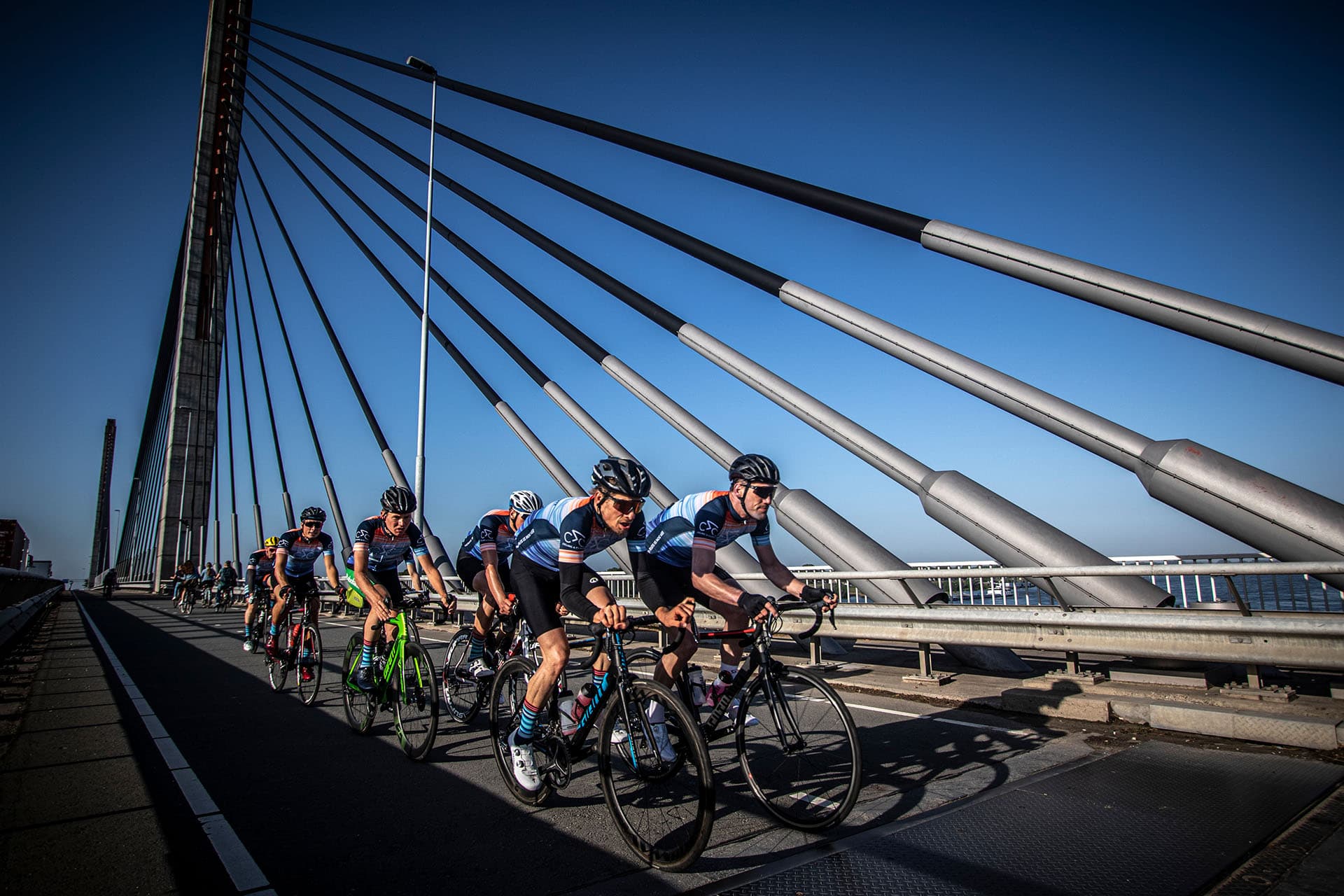 climate classic riders across bridge